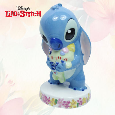 Introducing the Lilo & Stitch - Limited Edition Stitch Statuette, a must-have collectible for all Lilo & Stitch and Disney fans! This exquisite figurine features the adorable Stitch from the Lilo & Stitch movie, captured in a heartwarming moment as he lovingly embraces Lilo's beloved homemade Scrump doll. Shop Now at Jewels of St Leon Jewellery, Giftware and Watches.