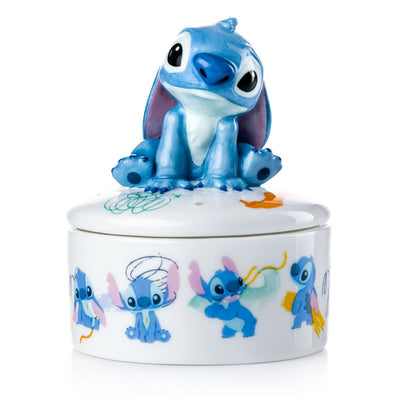 If you're a fan of Disney's Lilo and Stitch, then you'll love the Stitch Mini Treasure Box! This beautiful trinket box is handmade and decorated using fine bone china, making it a genuinely collectable piece. The box is adorned with imagery of Stitch throughout, making it a must-have for any Lilo and Stitch enthusiast.