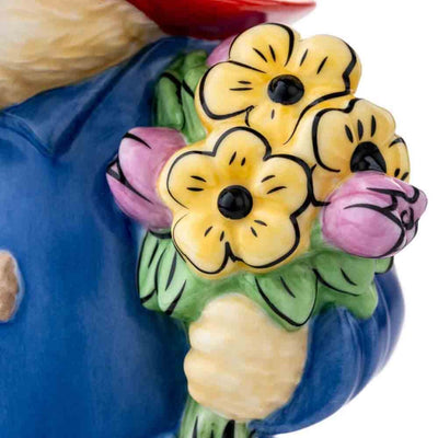 Close-Up of Bouquet: A detailed view of the bouquet in Paddington’s hand, showcasing the delicate, vibrant flowers that symbolize his loving gesture, paired with impeccable fine china artistry.