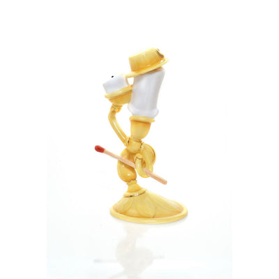 The Lumiere figurine is handcrafted from fine bone china and features elegant 22K gold trim. This characteristic cheeky pose of Lumiere is an exquisite statuette makeing it the perfect addition to any Disney or Beauty and the Beast collection or as a gift for that special someone who loves the story. Display it on a shelf, desk, or table to bring a touch of charm to any room.