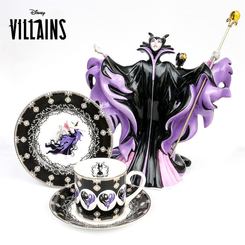 The Mistress of All Evil - Maleficent Collectors Set - Handmade Fine Bone China, Hand Decorated and trimmed in 22K gold. Features the Limited Edition Full Sized Maleficent Figurine, 6" Collectors Plate and Cup and Saucer Set. Exclusively Available from Jewels of St Leon.