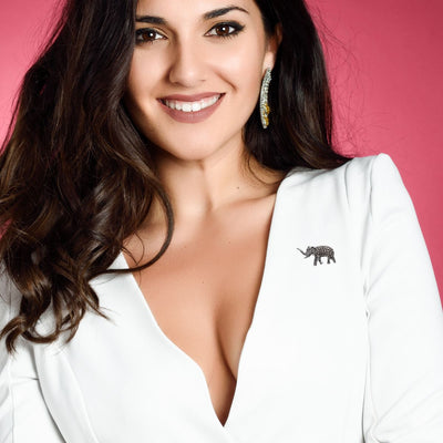 A model wearing the Marcasite Elephant Brooch on a chic blazer, showcasing its elegant design and vintage-inspired charm. A perfect statement piece for any outfit, adding a touch of sophistication to your look.