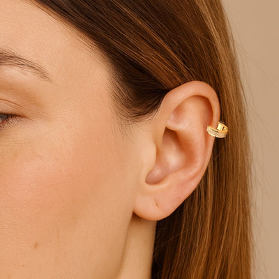 Model wearing 4×12 mm waterproof 18ct gold-plated stainless steel hoop earring with glass-blast finish.