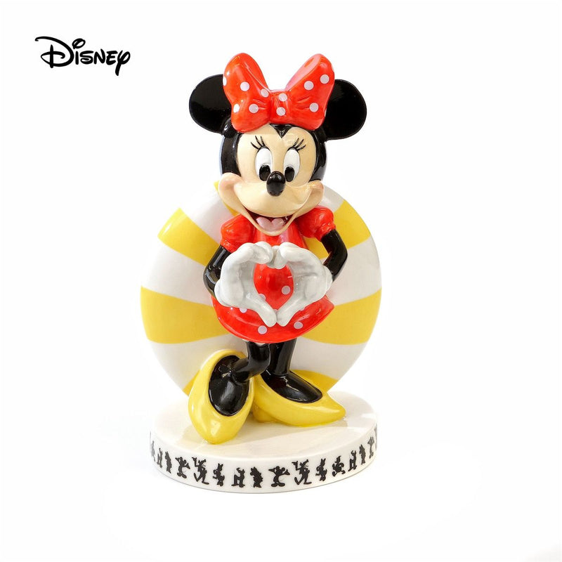 Looking for a timeless piece to add to your Disney collection? Look no further than the Modern - Minnie Mouse Figure from our classic Mickey Mouse and Friends range. This figurine is a must-have for any Disney fan, with its vibrant and rich colours bringing this beloved character Minnie Mouse to life. This figure is made from fine bone china and built to last a lifetime.
