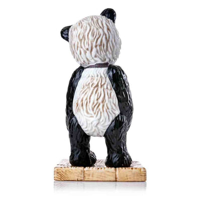 A back view of Mr. Widget highlights the meticulous hand-painted details of his textured mohair fur in black, white, and brown tones. The sculpted folds of his checked bow extend around his neck for a complete look.