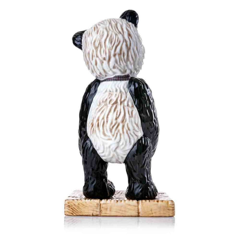 A back view of Mr. Widget highlights the meticulous hand-painted details of his textured mohair fur in black, white, and brown tones. The sculpted folds of his checked bow extend around his neck for a complete look.