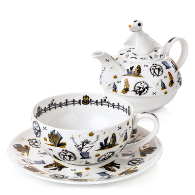 The teapot is beautifully separated from the cup and saucer, revealing its charming details. Handmade and hand-painted, this set captures the enchanting spirit of Halloween Town.