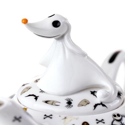 Zero perches atop the teapot in a stunning close-up, surrounded by Halloween-themed designs. Handmade and hand-painted, this whimsical detail completes the set's charm.