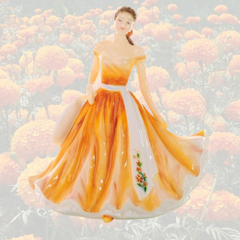 The October Flower of the Month petite figurine is the Marigold, known for its sunny colours; the statue represents optimism, prosperity, and affection, as well as a love charm for those born in the month of October.