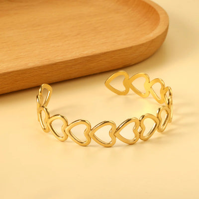 Close-up of the adjustable open cuff design, highlighting the smooth contours and refined detailing.