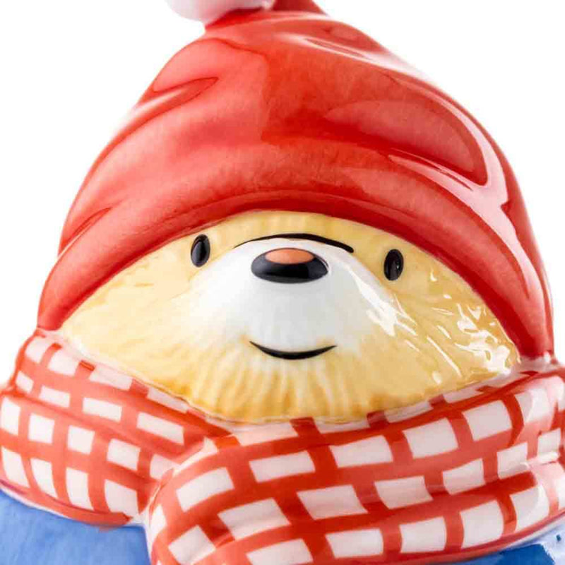 A close up of Paddington Bear First Snowball Figurine, see his beautiful face, wearing a Santa Hat and Scarf. Handmade and Hand Painted fine china Paddington Bear Figurine.