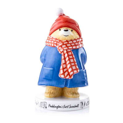 Paddington Bear First Snowball Figurine - This is a beautiful seasonal figurine for Christmas or Winter. Paddington is wearing a red beanie and scarf, while holding a snowball. 