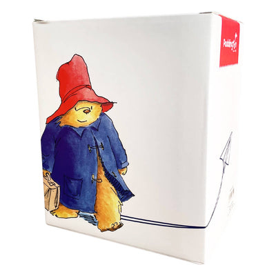 Paddington Bear First Snowball Figurine comes elegantly packaged in a beautiful box featuring Paddington wearing his iconic blue duffle and red hat, while carrying his brown bag.