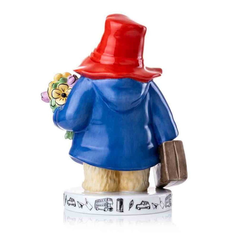 The back of the figurine showcases Paddington’s flowing blue coat, the fine details of his red hat, and the craftsmanship of his suitcase, completing the nostalgic look.