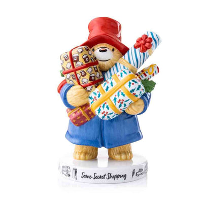 Paddington Bear - Some Secret Shopping Figurine. Paddington is peaking out from behind an arm full of packages.