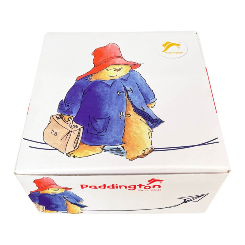 The cup and saucer set displayed in its premium gift box, elegantly designed with Paddington-inspired motifs, making it a perfect collector&