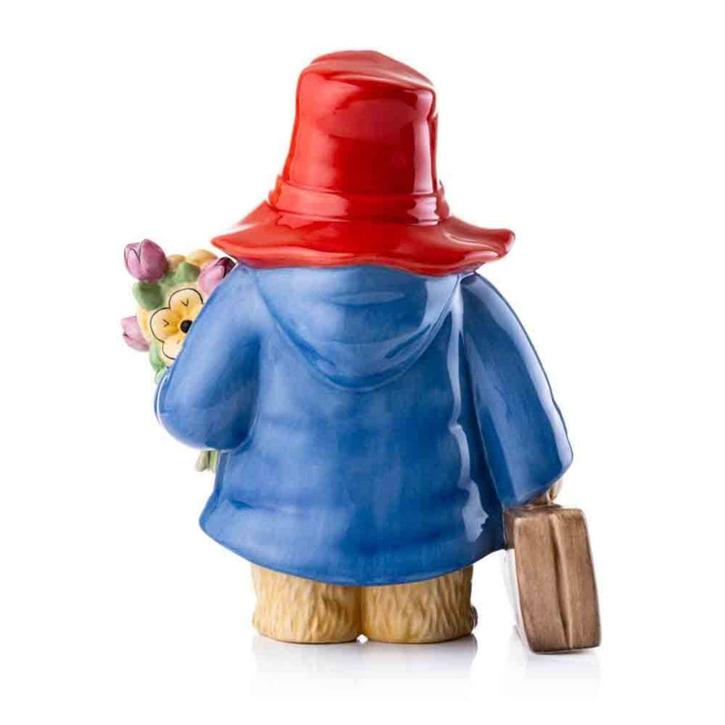 The rear of the figurine showcases Paddington’s iconic red hat and blue coat with intricate hand-painted detailing, capturing the essence of Peggy Fortnum’s original illustrations.