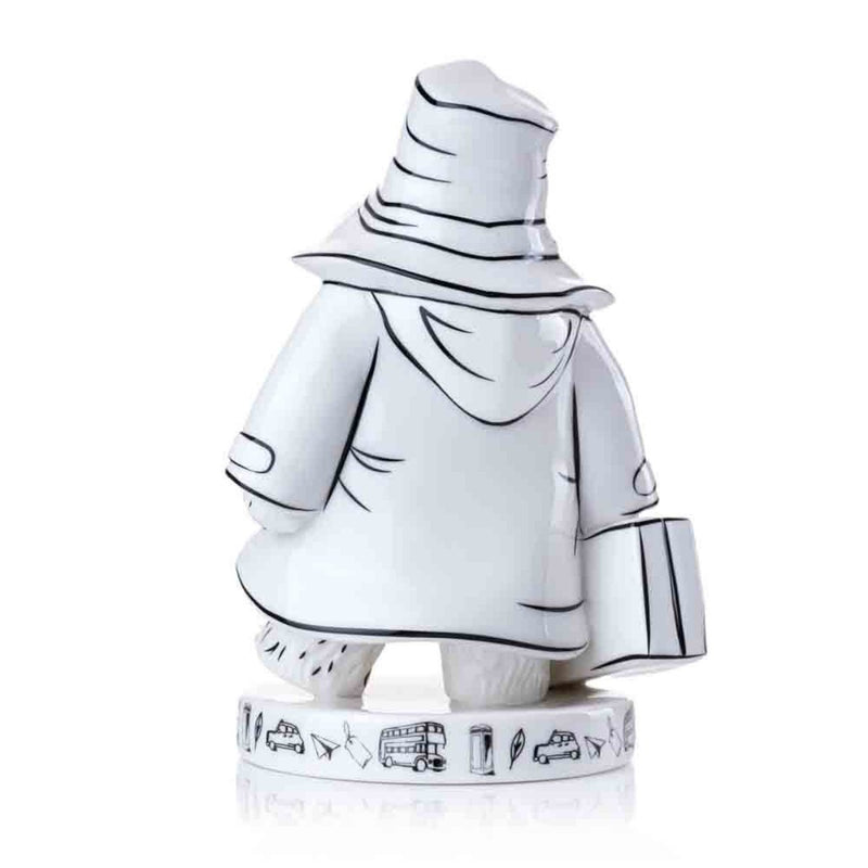 Paddington is viewed from a slight angle, emphasizing the depth of the monochrome design and the artistic London-themed motifs encircling the base.