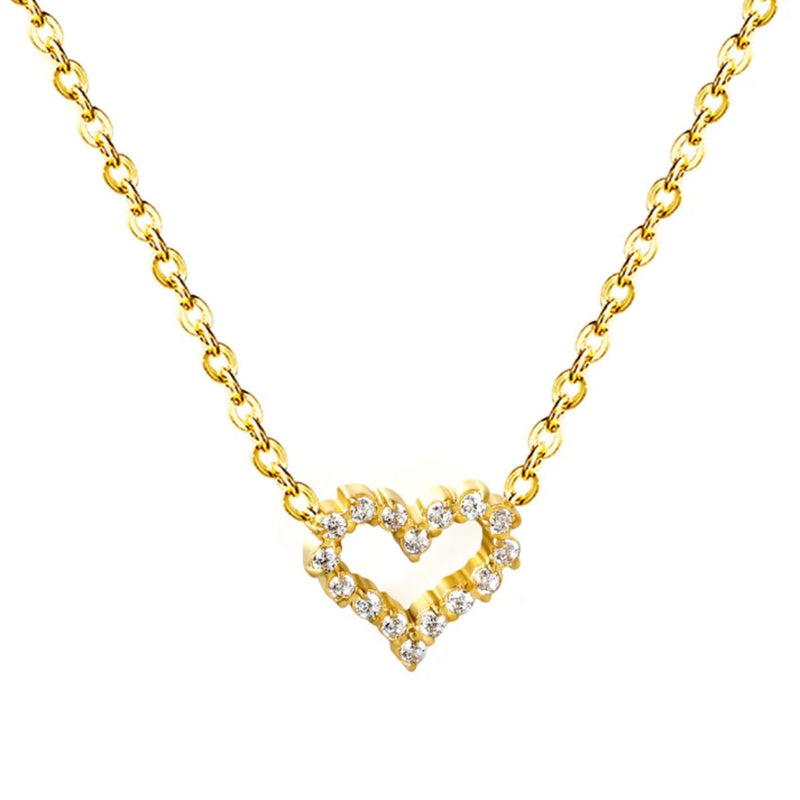 Close-up of the Petite Pavé Heart Pendant showing the fine CZ detailing and the soft glow of 18K gold plating.