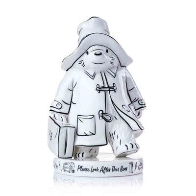 The Sketch Style Paddington Bear figurine is shown front-on, highlighting the intricate monochrome details of his iconic red hat, blue duffle coat, and suitcase, inspired by Peggy Fortnum’s original illustrations.