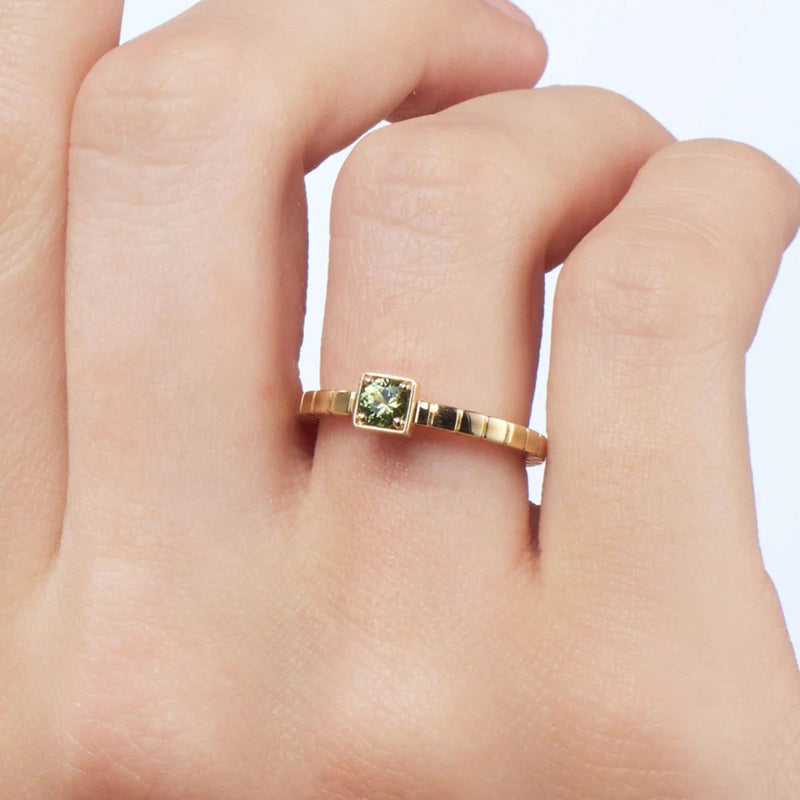 A close-up shot of the Quinn Ring on a model&