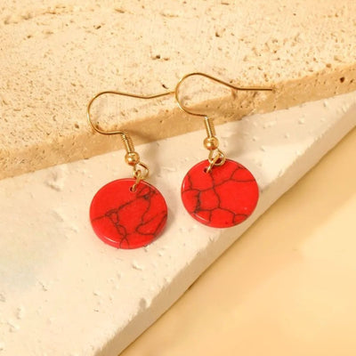Red Jasper Style Earrings displayed elegantly on a light background, emphasizing their vibrant red design and trendy dangle style.