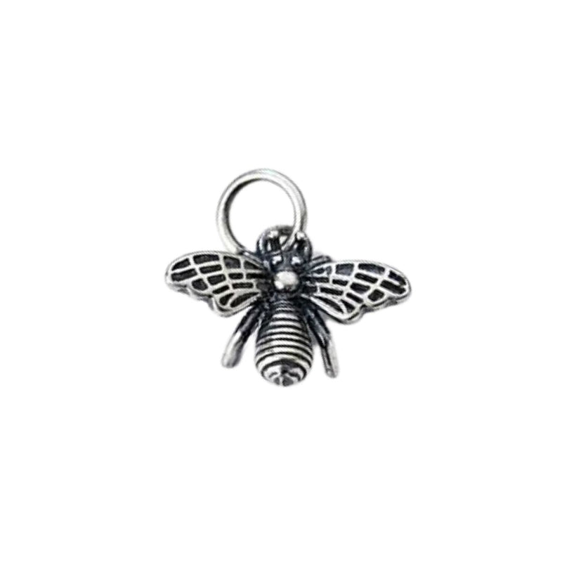 A detailed close-up of the Silver Oxidised Honey Bee Charm Pendant, highlighting its intricate wings and darkened oxidised finish, bringing depth and charm to this nature-inspired design.