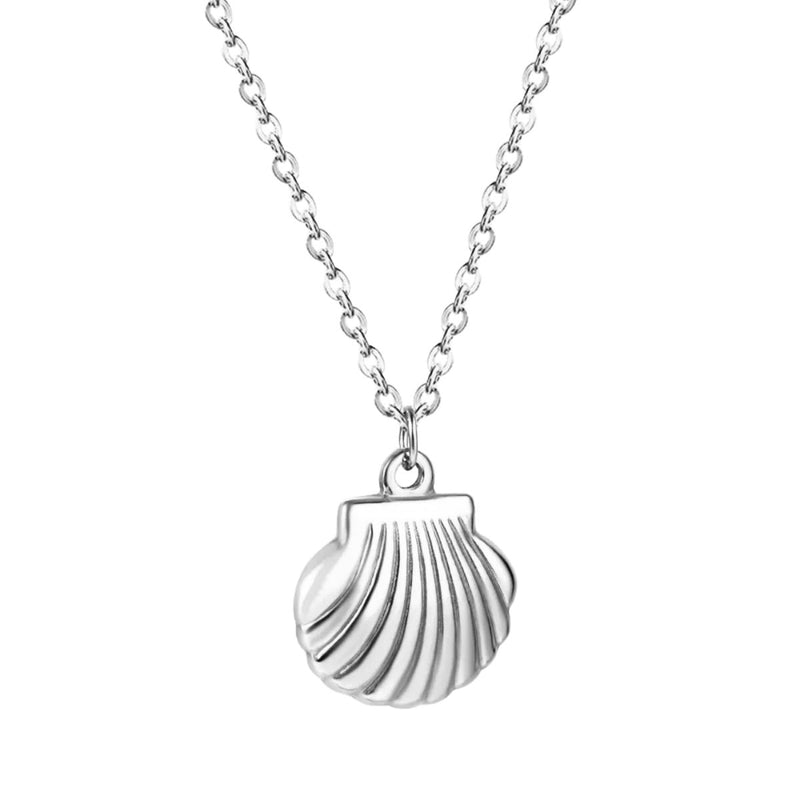 A close up of the Silver Shell Necklace, highlighting the soft shine of the stainless steel and the fine shell detailing.