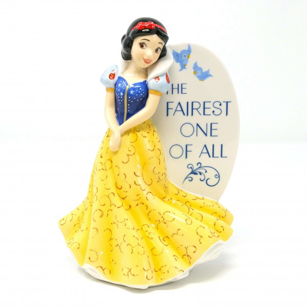 This exquisite Snow White Flat Back Figurine will take your breath away. Standing approximately 6 inches high, this beautifully crafted piece is perfect for Disney lovers of all ages. The figurine features Snow White, the beloved Disney Princess, with the inscription "The Fairest One of All" on the flat back.