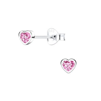Close-up of 4x4mm children's pink heart cubic zirconia stud earrings in Sterling Silver, displayed on a white background. Delicate design with butterfly backs.