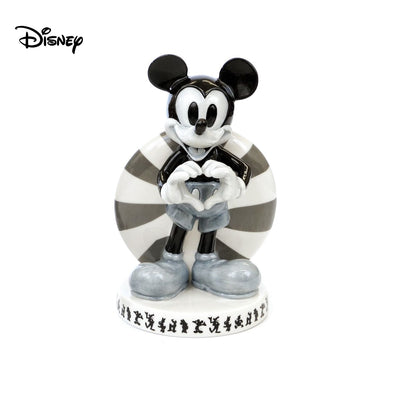 The Vintage Mickey Mouse Figure, a classic addition to our Mickey Mouse and Friends range that Disney fans worldwide love. This timeless figurine features a black and white colourway, adding a vintage spin to the world's most beloved mouse. Shop now at Jewels of St Leon Jewellery, Giftware and Watches.