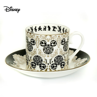 This Vintage Mickey Mouse Cup and Saucer Set is a must for any Disney lover. The set is elegant and made of fine bone china with 100% platinum trim. The hand-decorated Mickey and Friends design adds a touch of nostalgia to your collection. This is a timeless treasure, perfect for tea parties or as a decorative piece. Shop now at Jewels of St Leon Jewellery, Giftware and Watches.