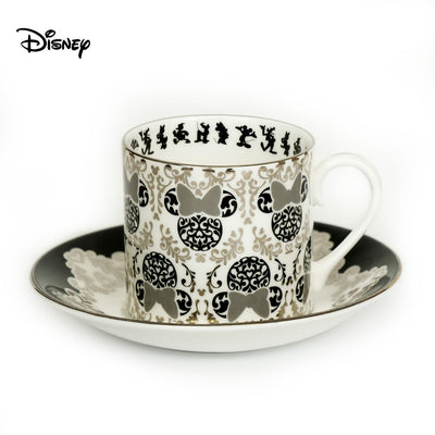 This Vintage Minnie Mouse Cup and Saucer Set is a must for any Disney lover. The set is elegant and made of fine bone china with 100% platinum trim. The hand-decorated Mickey and Friends design adds a touch of nostalgia to your collection. This is a timeless treasure, perfect for tea parties or as a decorative piece. Shop now at Jewels of St Leon Jewellery, Giftware and Watches.