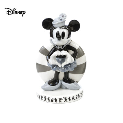 Check out Vintage Minnie Mouse Figure from Mickey Mouse and Friends. This figurine is a must for any Disney fan, with its vintage black and white colourway for a unique spin on the beloved character. Made from fine bone china, master painter Dan Smith has hand-designed this figurine to ensure every detail is perfect. Shop now at Jewels of St Leon.