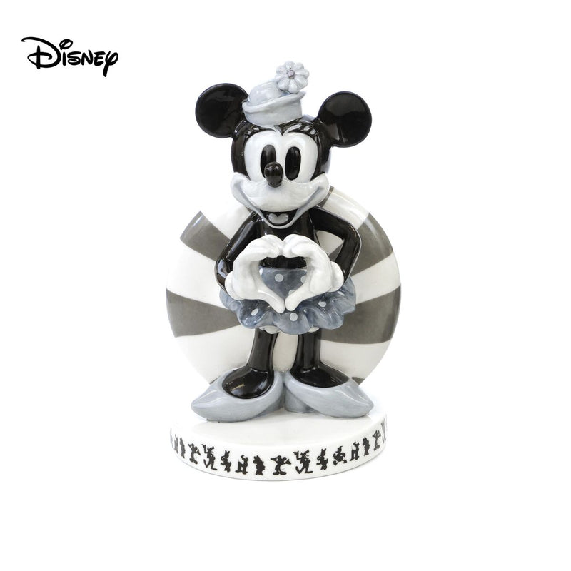 Check out Vintage Minnie Mouse Figure from Mickey Mouse and Friends. This figurine is a must for any Disney fan, with its vintage black and white colourway for a unique spin on the beloved character. Made from fine bone china, master painter Dan Smith has hand-designed this figurine to ensure every detail is perfect. Shop now at Jewels of St Leon.