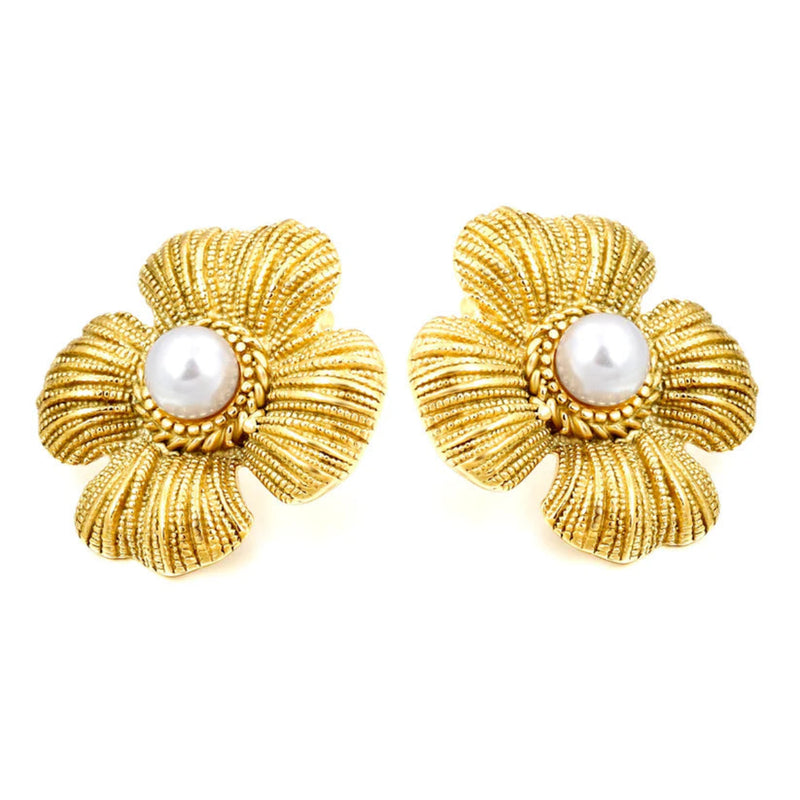Front-facing product shot of vintage-style four-petal flower earrings in 18kt gold-plated stainless steel with central white pearls, isolated on white background.