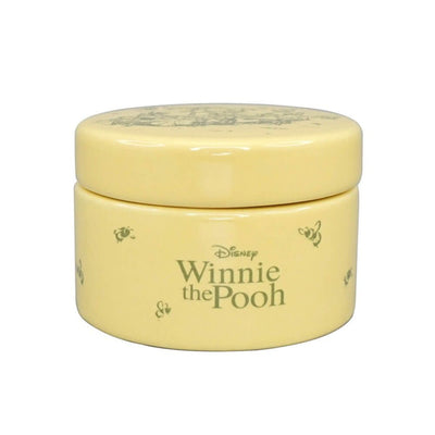 A front view highlighting the smooth ceramic finish and iconic yellow colouring, with Disney Winnie the Pooh, surrounded by bees for inspirational and timeless charm.