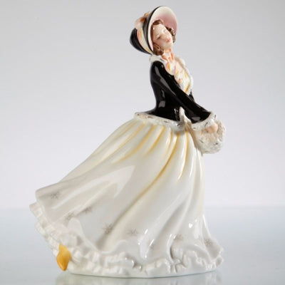 The Winter’s Day Figurine captures the crisp elegance of the season, dressed in a flowing white gown and a luxurious black ermine-lined jacket. With a charming pose, she searches for a frosted pond, ready for winter's wonders. Hand-painted in fine bone china, available from Jewels of St Leon.