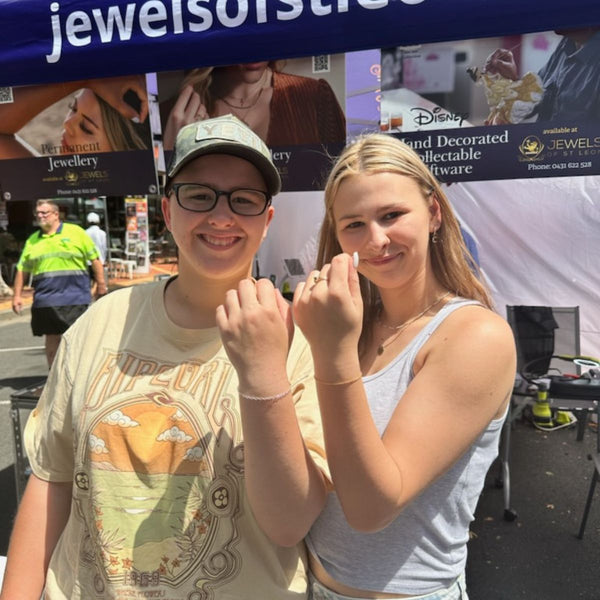 Friends displaying their newly welded permanent jewellery bracelets at Jewels of St Leon mobile event in Tamworth NSW.