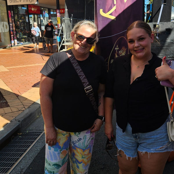 Two happy guests showing their permanent jewellery bracelets at a Tamworth Country Music Festival 2026 event by Jewels of St Leon.
