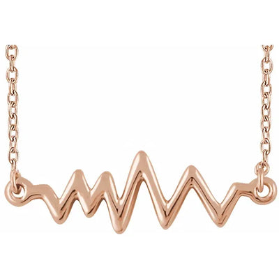 Our 14K Rose Gold Heartbeat Necklace for women is a stunning piece of jewellery that features a 22.8x6.8mm centre pendant adorned with 35 natural diamonds, adding a touch of elegance and sparkle. The necklace comes with a 40-45cm adjustable chain, ensuring a comfortable fit for any wearer. Available from Jewels of St Leon online jewellery Australia.