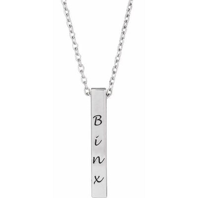 Close-up of the 17x2.5mm Sterling Silver Bar Necklace engraved with "Binx." The sleek, polished finish highlights the delicate engraving, perfect for a personalised, timeless accessory that complements any style.