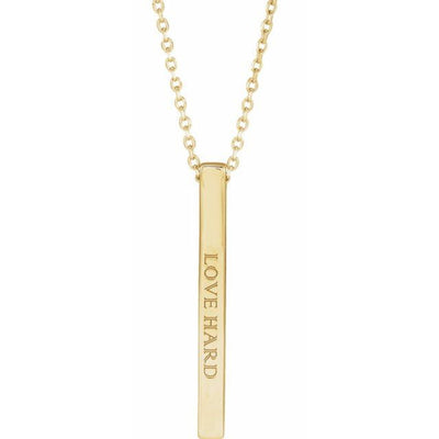 Close-up of the 14K Gold 25x2.6mm Engravable Bar Necklace inscribed with "Love Hard" in elegant Colonna MT font. The polished finish and sleek design make it a perfect personalised statement piece.