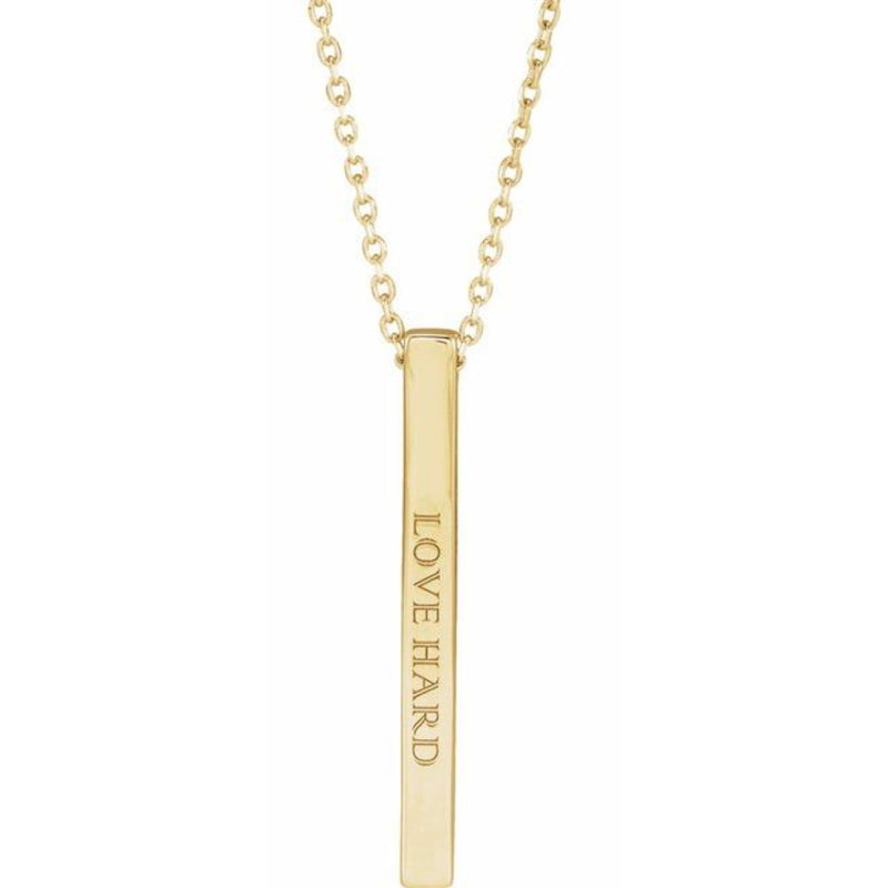 Close-up of the 14K Gold 25x2.6mm Engravable Bar Necklace inscribed with "Love Hard" in elegant Colonna MT font. The polished finish and sleek design make it a perfect personalised statement piece.