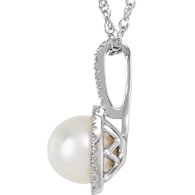 Side View - This freshwater cultured white pearl and 0.15CTW natural diamond sterling silver necklace is a stunning piece of jewellery that will elevate any outfit. The necklace features a 6.5-7.0mm cultured pearl at the centre, surrounded by a halo-style setting with 0.15CTW natural diamonds. The pendant size measures 15.4x8.7mm and is suspended from a 45cm rhodium-plated 925 sterling silver chain. Available from Jewels of St Leon Online Jewellery Australia.