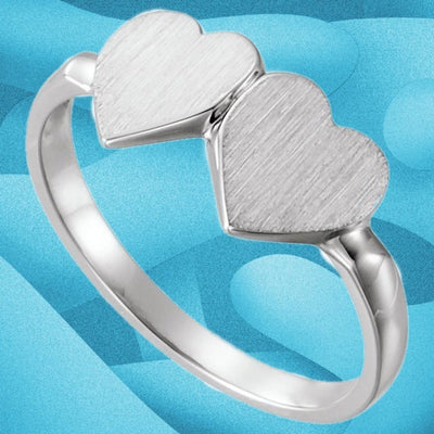 Sterling silver double heart signet ring with brushed 13.8x7mm heart top and polished band against a blue background